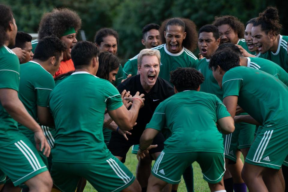 New coach Thomas Rongen (Michael Fassbender, center) fires up his American Samoa soccer team in "Next Goal Wins."