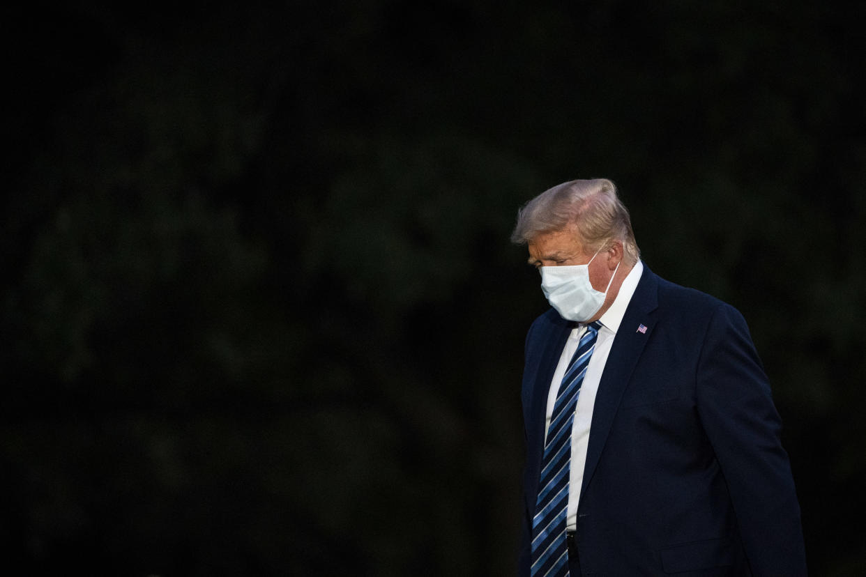 WASHINGTON, DC - OCTOBER 5: President Donald J. Trump disembarks Marine One and walks across the South Lawn as he returns home after receiving treatments for the covid-19 coronavirus at Walter Reed National Military Medical Center, at the White House on Monday, Oct 05, 2020 in Washington, DC. (Photo by Jabin Botsford/The Washington Post via Getty Images)