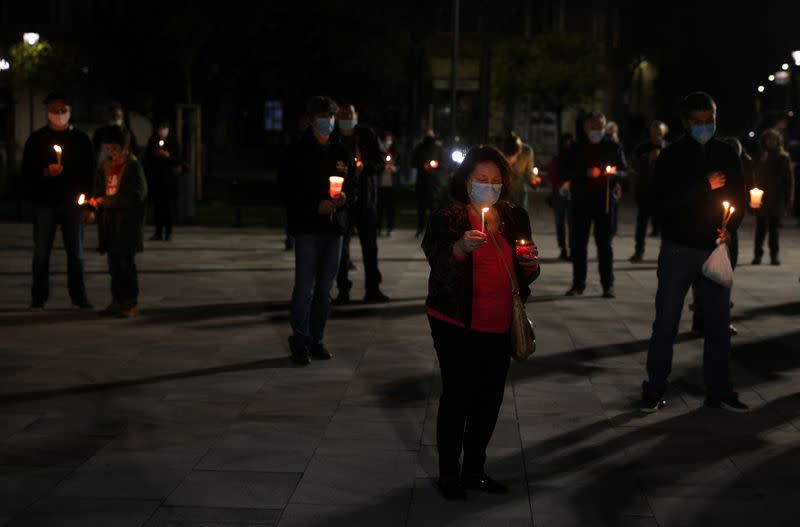 People attend Orthodox Easter service outside Sveti Sedmochislenitsi church in Sofia