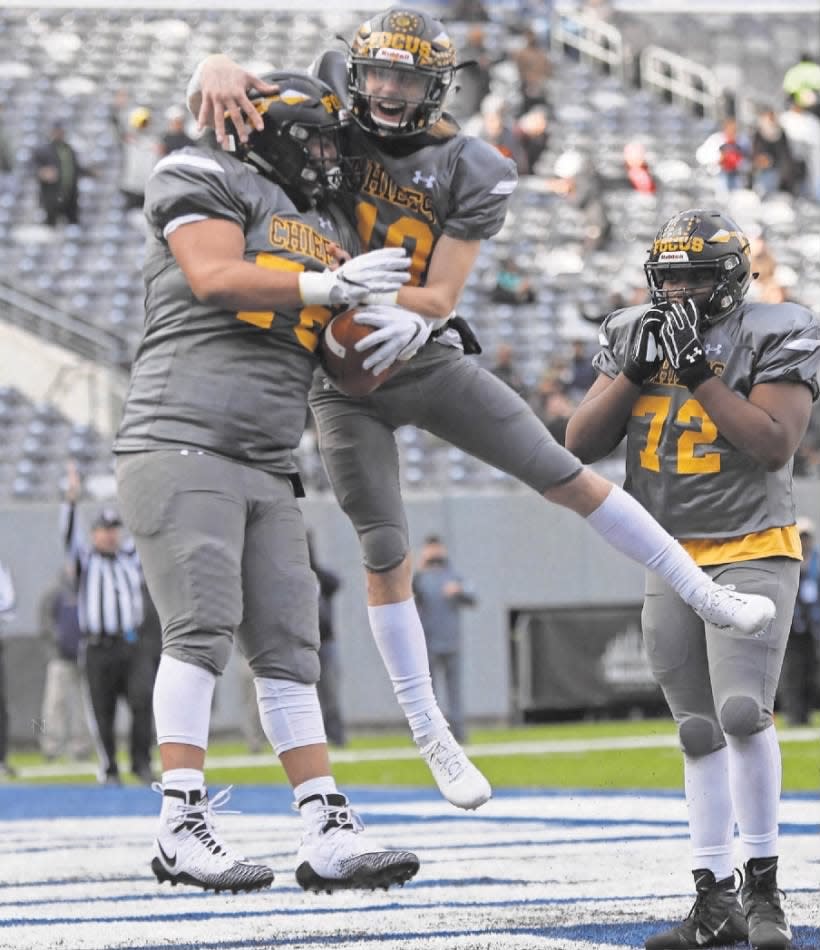Piscataway offensive lineman Jordan Martell scores a second-quarter touchdown on a fumble recovery and celebrates with teammate Joseph Hatcher on Saturday, Dec. 1, 2018. Piscataway went on to win 31-21 over Ridgewood at MetLife Stadium in East Rutherford.