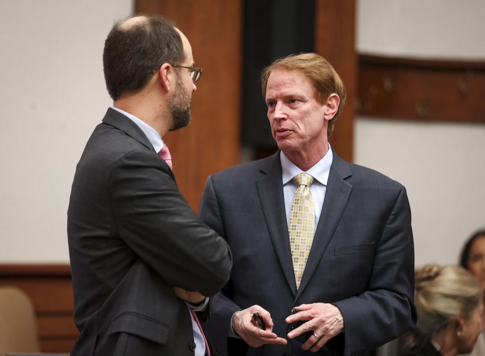 Senator Tim Knopp, R-Bend, speaks with Attorney Dustin Buehler, with the Oregon Department of Justice, before oral arguments are made in front of the Oregon Supreme Court on Thursday, Dec. 14, 2023 in Salem, Ore. Republicans are challenging the implementation of Measure 113, an effort to put a stop to legislative walkouts. (Abigail Dollins/Statesman-Journal via AP, Pool)