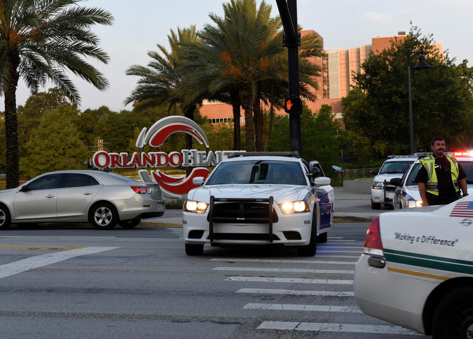 <p>Police lock down Orange Avenue around Pulse nightclub, where people were killed by a gunman in a shooting rampage in Orlando, Florida June 12, 2016. (REUTERS/Kevin Kolczynski) </p>