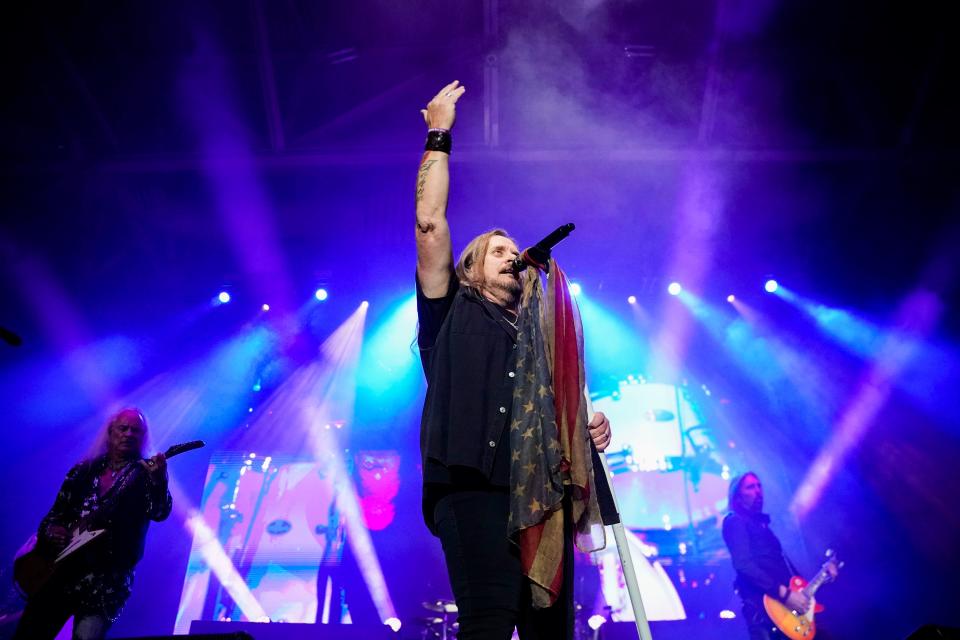 Johnny Van Zant, lead vocalist of Lynyrd Skynyrd, motions to the crowd during the Boots on the Sand: Hurricane Ian Relief Fundraiser at Hertz Arena in Estero on Thursday, Dec. 1, 2022.