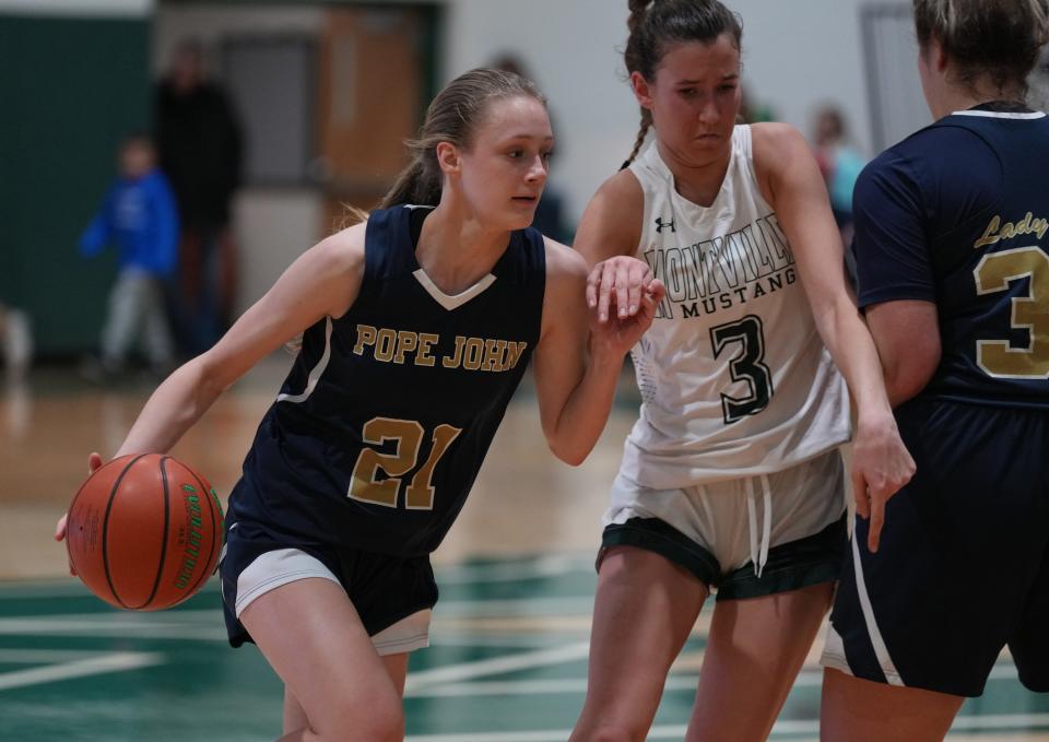 Addison Platt of Pope John is guarded by Katie Gorski of Montville in the first half as Montville topped Pope John 64-39 in NJAC-American girls basketball played in Montville, NJ on January 12, 2023.