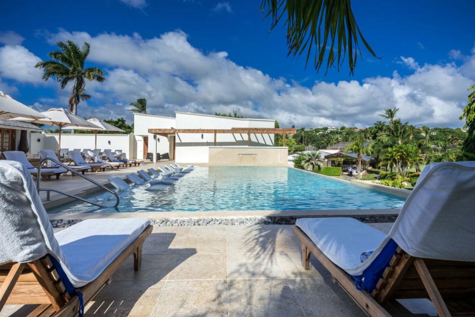 Infinity pool overlooks the manicured lawns (Calabash)