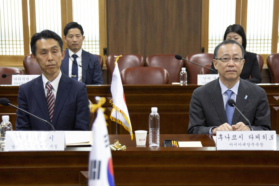 Japan's Funakoshi Takehiro Funakoshi, right, director-general of Foreign Ministry's Asian and Oceanian Affairs Bureau and Japan's Atsushi Ando, deputy director-general of Defense Minister's Defense Policy Bureau attend a meeting with South Korean Seo Min-jeong, director-general of the Asian and Pacific Affairs Bureau and Woo Kyoung suk, deputy director-general of the International Policy Bureau, at the Foreign Ministry in Seoul Monday, April 17, 2023. (Jeon Heon-Kyun/Pool Photo via AP)