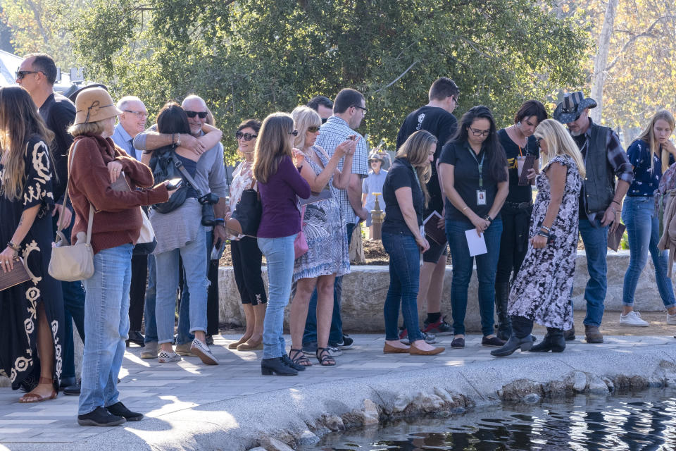 People look at the Borderline Healing Garden at Conejo Creek Park in Thousand Oaks, Calif., Thursday, Nov. 7, 2019. The dedication marked the anniversary of a fatal mass shooting at a country-western bar a year earlier. (Hans Gutknecht/The Orange County Register via AP)