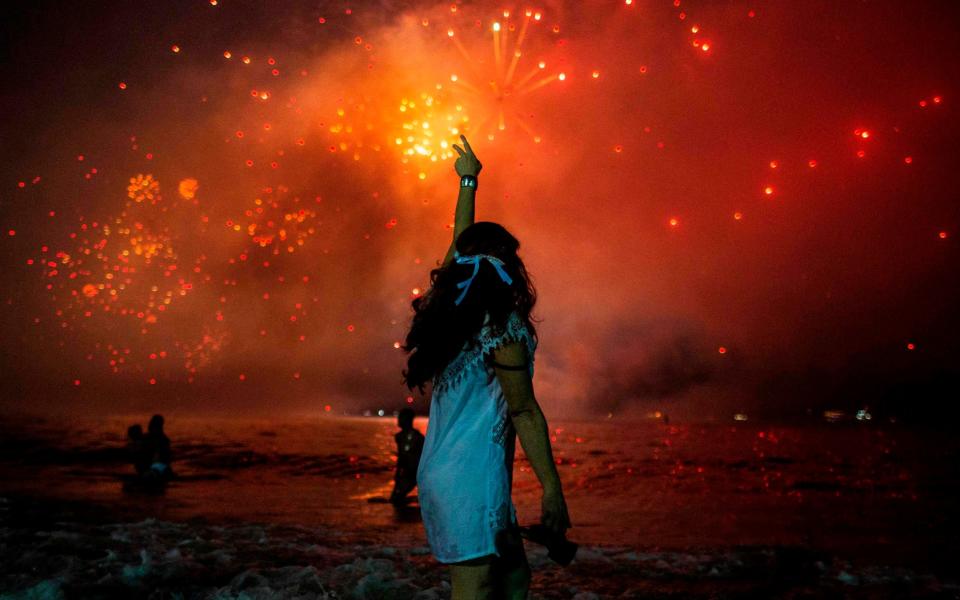 A reported 3 million people attended the fireworks at Copacabana beach last year - DANIEL RAMALHO /AFP