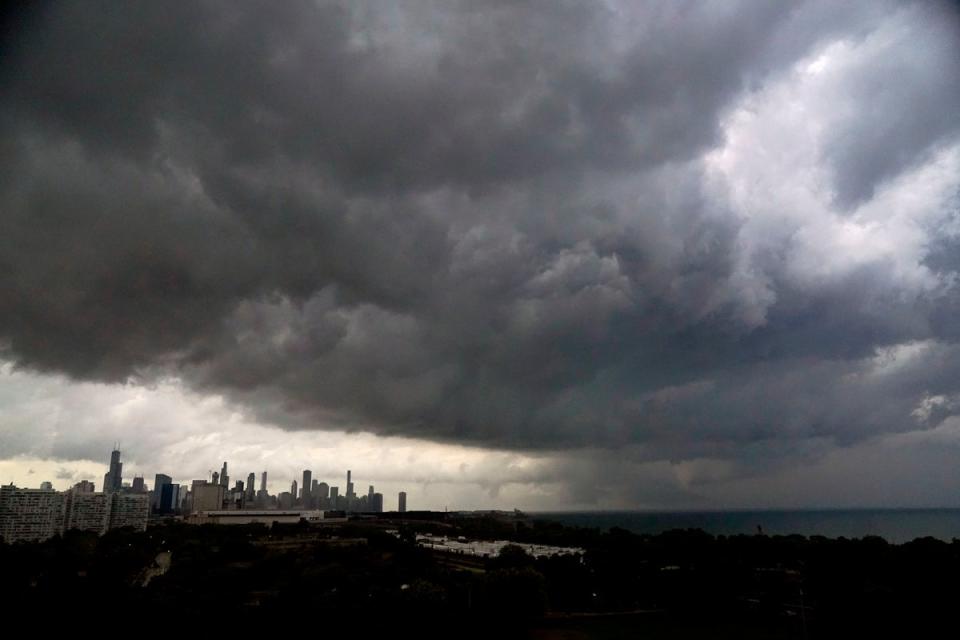 Storm clouds pass over downtown Chicago and the Bronzeville neighborhood of the city heading East out over Lake Michigan (AP)