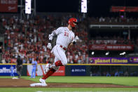 Cincinnati Reds' Jesse Winker runs the bases after hitting a two-run home run during the seventh inning of the team's baseball game against the St. Louis Cardinals in Cincinnati, Saturday, July 24, 2021. (AP Photo/Aaron Doster)