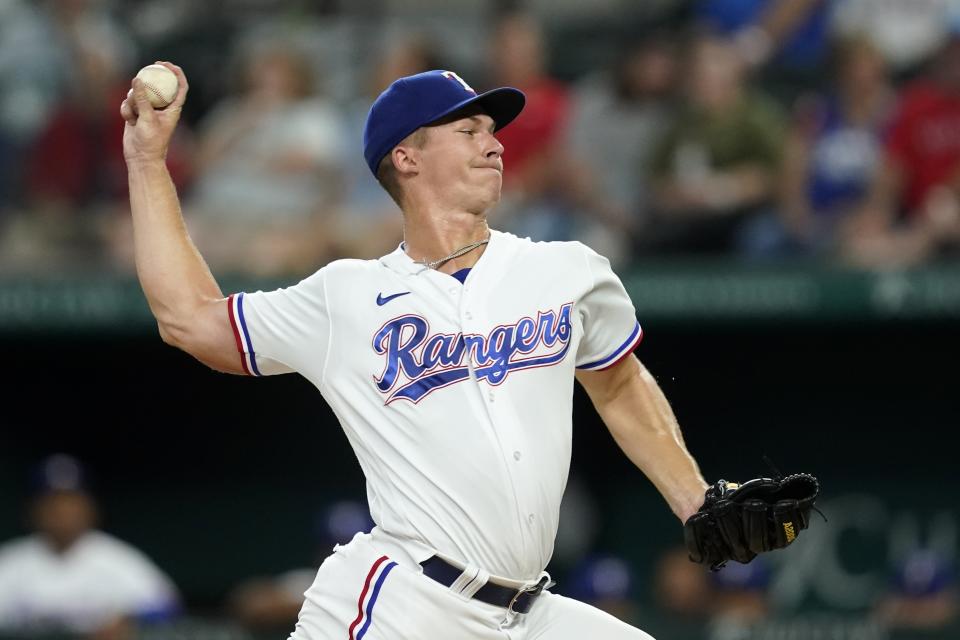 Texas Rangers starting pitcher Glenn Otto throws to an Oakland Athletics batter during the first inning of a baseball game in Arlington, Texas, Monday, Aug. 15, 2022. (AP Photo/Tony Gutierrez)