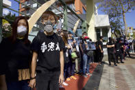 A boy wears a gas mask during a rally to protest against the exposure of children to tear gas by police in Hong Kong, Saturday, Nov. 23, 2019. U.S. President Donald Trump on Friday wouldn't commit to signing bipartisan legislation supporting pro-democracy activists in Hong Kong as he tries to work out a trade deal with China. (AP Photo/Ng Han Guan)