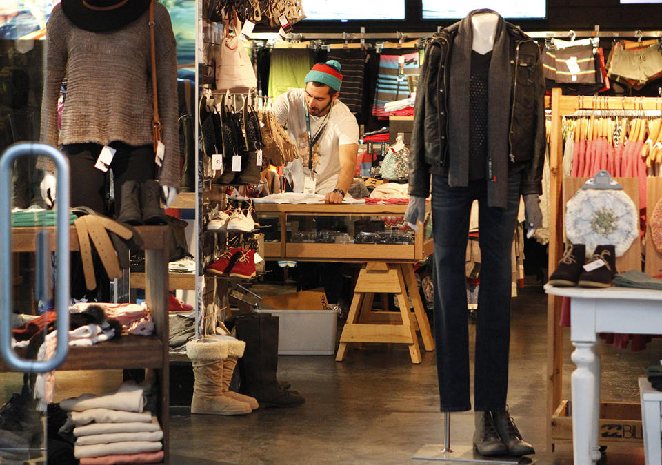 Shop assistant in clothing store