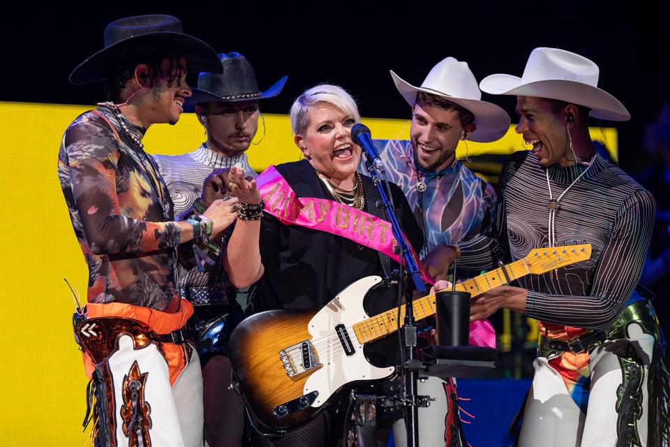 Natalie Maines of The Chicks is surprised with dancing cowboys (the troupe known as Bob's Dance Shop) for her birthday during Austin City Limits Music Festival on Friday.