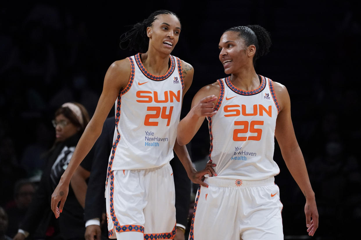 Connecticut Sun teammates and partners DeWanna Bonner and Alyssa Thomas find ways to support each other on the court. (AP Photo/John Minchillo)