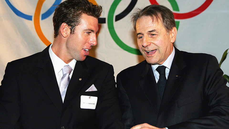 Jacques Rogge, pictured here with Australian swimming great Grant Hackett in 2005. 