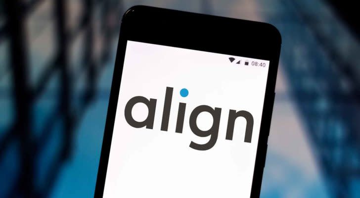 a smartphone displays the Align (ALGN) logo