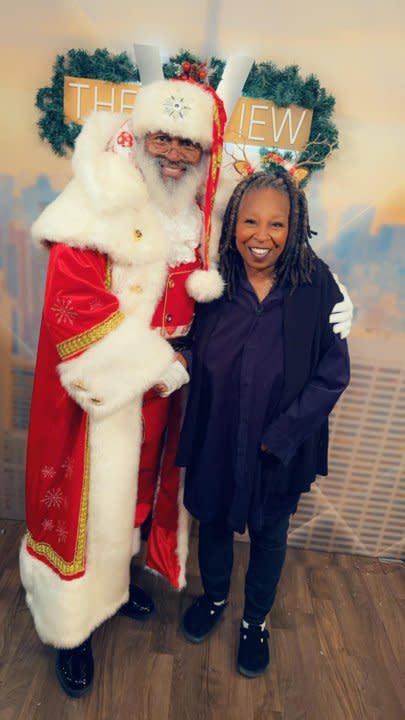 Santa Blair taking pictures with Whoopie Goldberg. {Mayor David Holt}