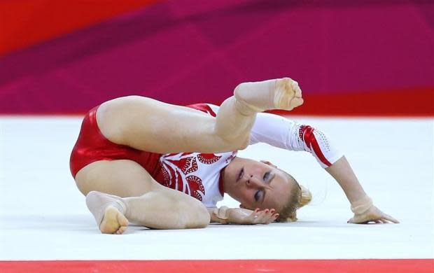 Russia's Kseniia Afanaseva falls during her floor exercise during the women's gymnastics team final in the North Greenwich Arena at the London 2012 Olympic Games July 31, 2012.