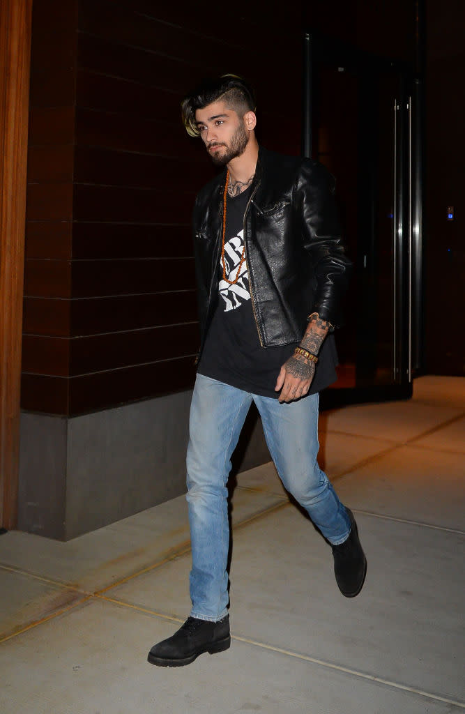 Zayn Malik wears jeans, a t-shirt, and a leather jacket in New York.