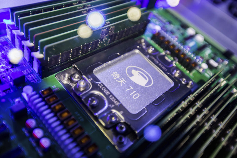 This photo shows a view of the ARM-structure server processor Yitian 710, developed by Alibaba's in-house semiconductor unit T-Head, at the Apsara Conference, an annual cloud service technology forum hosted by Alibaba Group, in Hangzhou in east China's Zhejiang province on Oct. 19, 2021. To help make China a self-reliant "technology superpower," the ruling Communist Party is pushing the world's biggest e-commerce company to take on the tricky, expensive business of designing its own processor chips, a business unlike anything Alibaba Group has done before. (Chinatopix via AP)