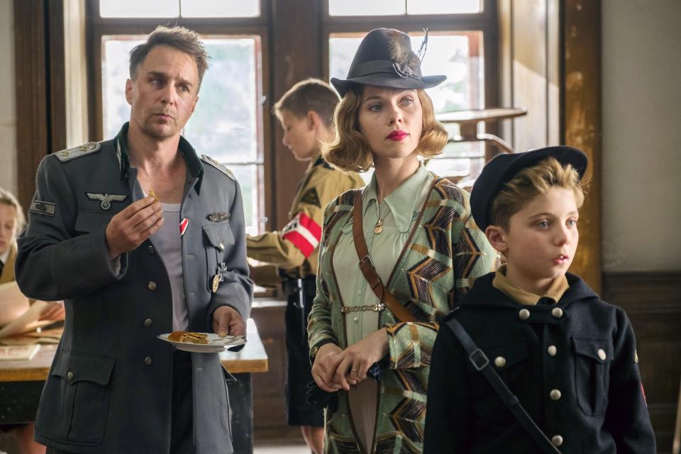 Sam Rockwell, Scarlett Johansson, and Roman Griffin Davis in Jojo Rabbit.