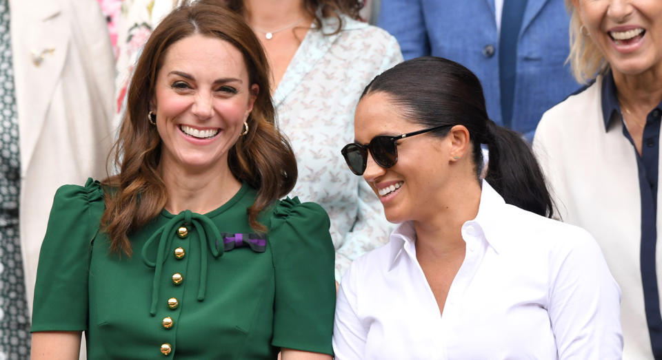 Meghan Markle wearing her Ray-Ban Round Sunglasses at Wimbledon with the Duchess of Cambridge in 2019. (Getty Images)