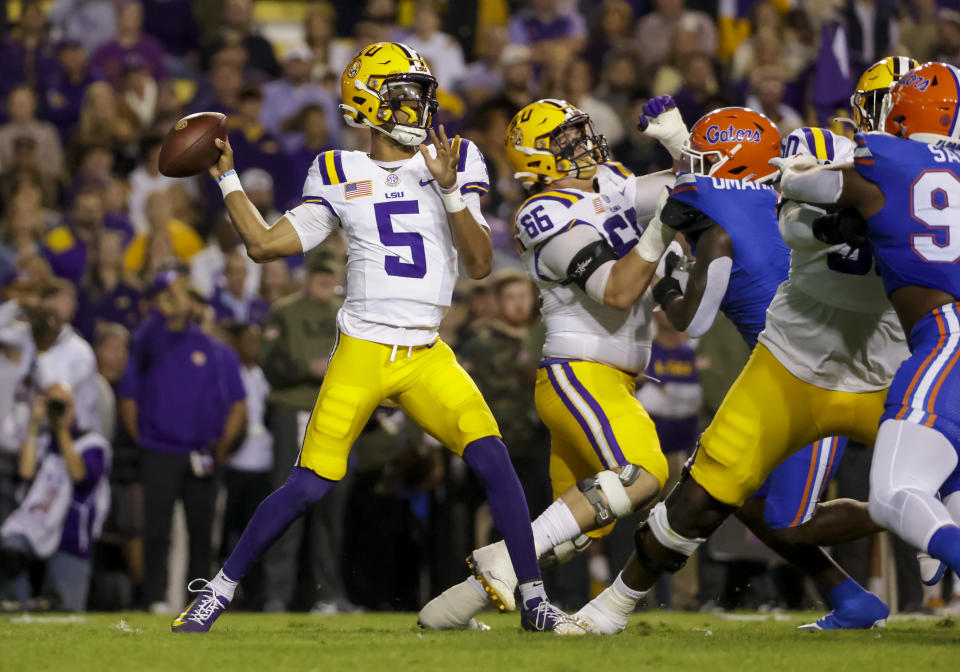 LSU quarterback Jayden Daniels (5) throws a pass against Florida during the first half of an NCAA college football game in Baton Rouge, La., Saturday, Nov. 11, 2023. (AP Photo/Derick Hingle)