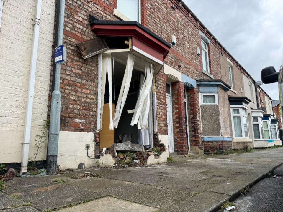 The Northern Echo: Blinds flap in the wind where the window once was as the lower wall has been reduced to rubble.