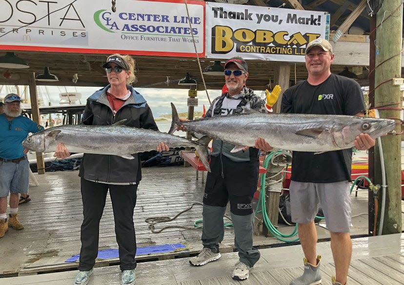 The crew from the Ray Marine/Strike Two show off their king mackerel in the AJ's Big Mac Classic. Kelly Lupola had the winning king at 48.8 pounds.