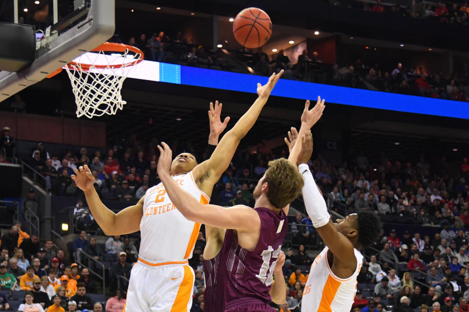 <p>Grant Williams #2 and Lamonte Turner #1 of the Tennessee Volunteers try to grab a rebound from Dana Batt #12 of the Colgate Raiders in the first round of the 2019 NCAA Men’s Basketball Tournament held at Nationwide Arena on March 22, 2019 in Columbus, Ohio. (Photo by Jamie Schwaberow/NCAA Photos via Getty Images) </p>