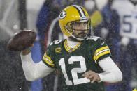 Green Bay Packers' Aaron Rodgers throws during the first half of an NFL football game against the Tennessee Titans Sunday, Dec. 27, 2020, in Green Bay, Wis. (AP Photo/Mike Roemer)