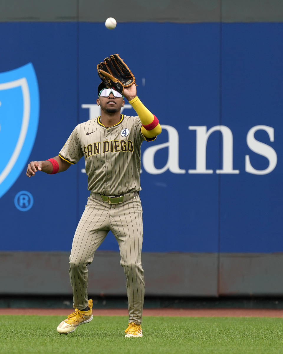 San Diego Padres center fielder Jose Azocar catches a fly ball for the out on Kansas City Royals' MJ Melendez during the third inning of a baseball game Sunday, June 2, 2024, in Kansas City, Mo. (AP Photo/Charlie Riedel)