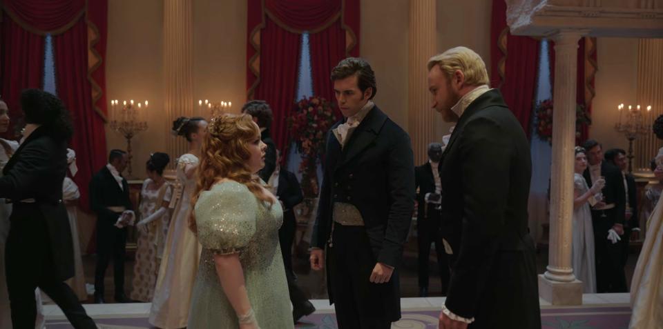 Nicola Coughlan as Penelope Featherington, Luke Newton as Colin Bridgerton, and Sam Phillips as Lord Debling on season three, episode four of "Bridgerton."