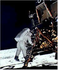 Compliments of NASA-JSC Buzz Aldrin prepares to take his first step on the moon, in 1969