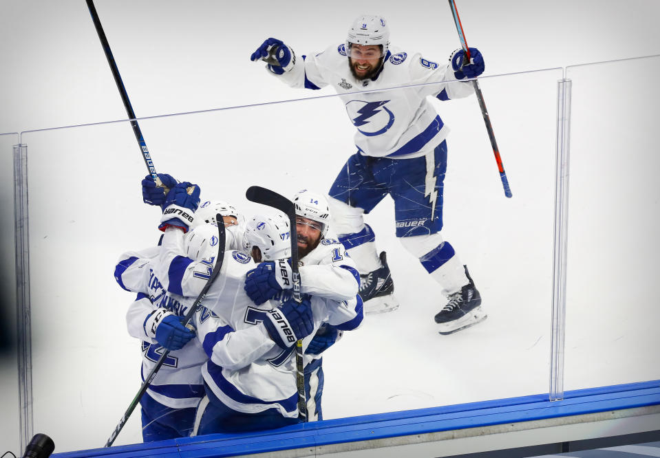 Sep 25, 2020; Edmonton, Alberta, CAN; Tampa Bay Lightning defenseman Kevin Shattenkirk (22) and defenseman Victor Hedman (77) and left wing Patrick Maroon (14) and center Tyler Johnson (9) celebrates a game winning goal scored by Shattenkirk against the Dallas Stars during the overtime period in game four of the 2020 Stanley Cup Final at Rogers Place. Mandatory Credit: Perry Nelson-USA TODAY Sports