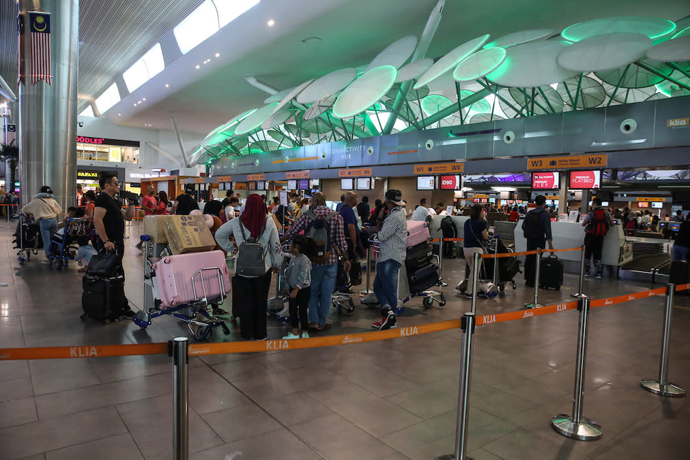 Passengers are seen at KLIA2 in Sepang August 22, 2019, during a systems outage. — Picture by Yusof Mat Isa