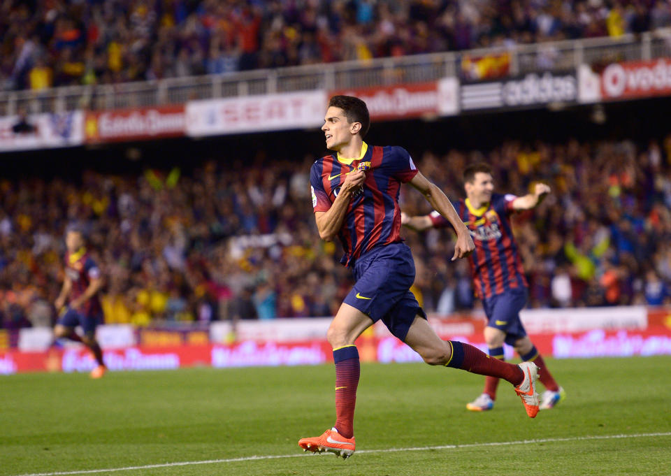 Barcelona's Marc Bartra celebrates after scoring his side's first goal during the final of the Copa del Rey between FC Barcelona and Real Madrid at the Mestalla stadium in Valencia, Spain, Wednesday, April 16, 2014. (AP Photo/Manu Fernandez)