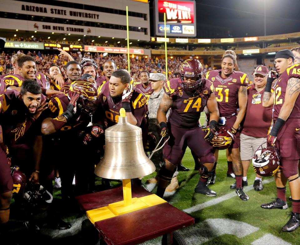 Arizona State offensive lineman Jamil Douglas (74) and teammates celebrate by ringing the bell after defeating Stanford 26-10 during an NCAA college football game, Saturday, Oct. 18, 2014, in Tempe, Ariz. (AP Photo/Rick Scuteri)                    