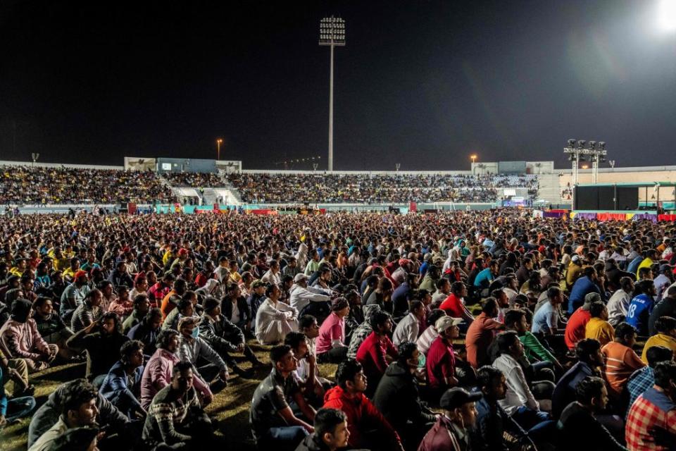 Spectators watch the World Cup match between Brazil and Switzerland, Group G, on a big screen on the outskirts of Doha, Qatar, on November 28, 2022.<span class="copyright">Mads Claus Rasmussen—Ritzau Scanpix/AFP via Getty Images</span>