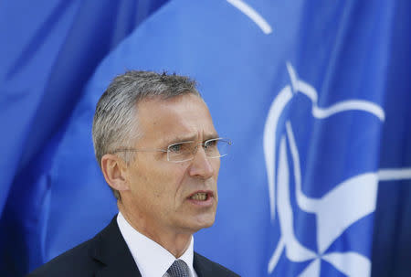 FILE PHOTO: NATO Secretary General Jens Stoltenberg speaks during a joint news conference with Ukrainian President Petro Poroshenko following a meeting of the NATO-Ukraine Commission in Kiev, Ukraine, July 10, 2017. REUTERS/Valentyn Ogirenko/File Photo