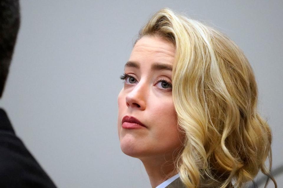 Actor Amber Heard listens in the courtroom at the Fairfax County Circuit Courthouse in Fairfax, Va., Monday, May 23, 2022. Actor Johnny Depp sued his ex-wife Amber Heard for libel in Fairfax County Circuit Court after she wrote an op-ed piece in The Washington Post in 2018 referring to herself as a “public figure representing domestic abuse.” (AP Photo/Steve Helber, Pool) (AP)