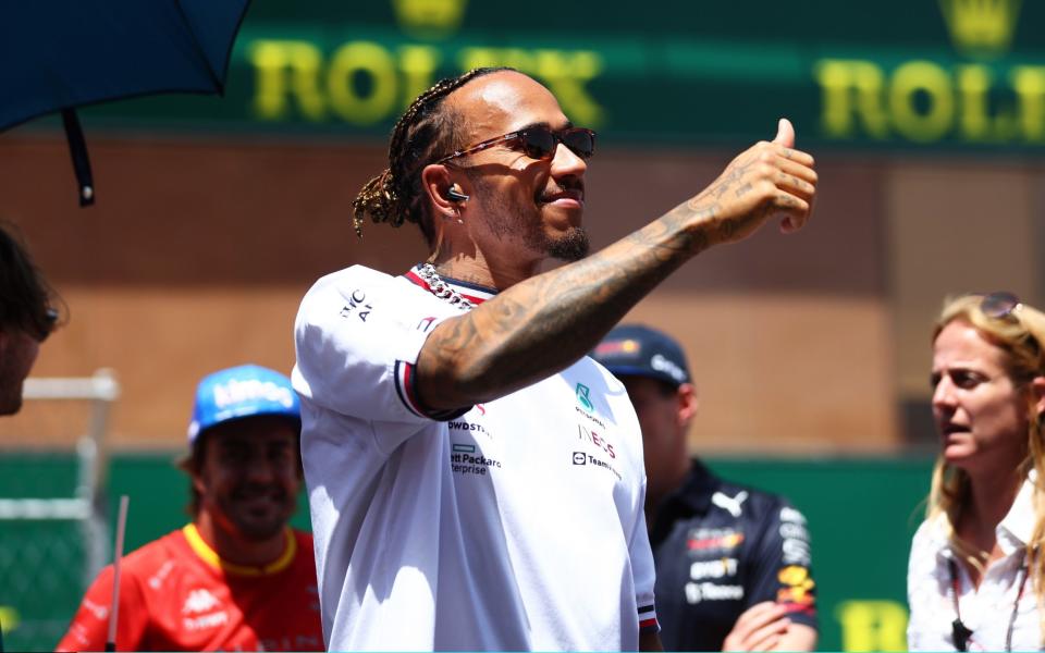 Lewis Hamilton of Great Britain and Mercedes waves to the crowd on the drivers parade prior to the F1 Grand Prix of Spain at Circuit de Barcelona - GETTY IMAGES