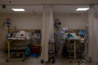 Medical workers treat patients infected with the coronavirus disease (COVID-19) at a hospital in New Delhi