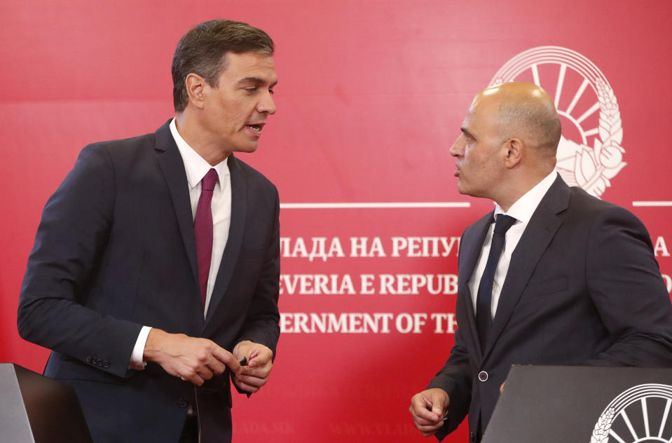 Spain's Prime Minister Pedro Sanchez left and North Macedonia's Prime Minister Dimitar Kovacevski, right, talk to each other during a joint news conference following their talks in the government building in Skopje, North Macedonia, on Sunday, July 31, 2022. Spanish Prime Minister Pedro Sanchez is on a one-day official visit to North Macedonia as a part of his Western Balkans tour. (AP Photo/Boris Grdanoski)