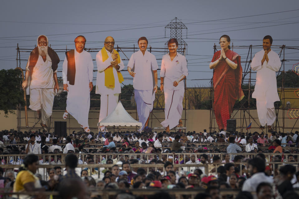 Giant cutouts of opposition political party leaders tower over supporters during a rally, on the outskirts of the southern Indian city of Chennai, April 15, 2024. (AP Photo/Altaf Qadri)