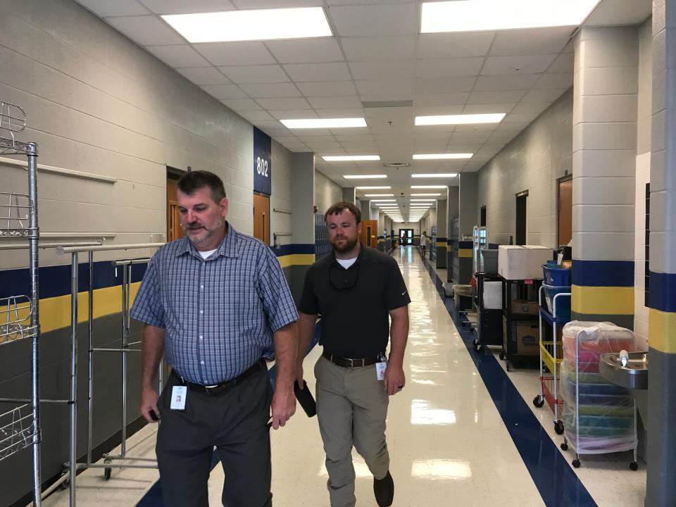 Wilson County Director of Schools Jeff Luttrell, left and Chief Financial Officer Michael Smith, right, in a hallway of a wing at West Wilson Middle School just before the school year began.  Stoner Creek Elementary has been using the wing of West Wilson Middle and now will have 10 portable units added to the temporary campus.