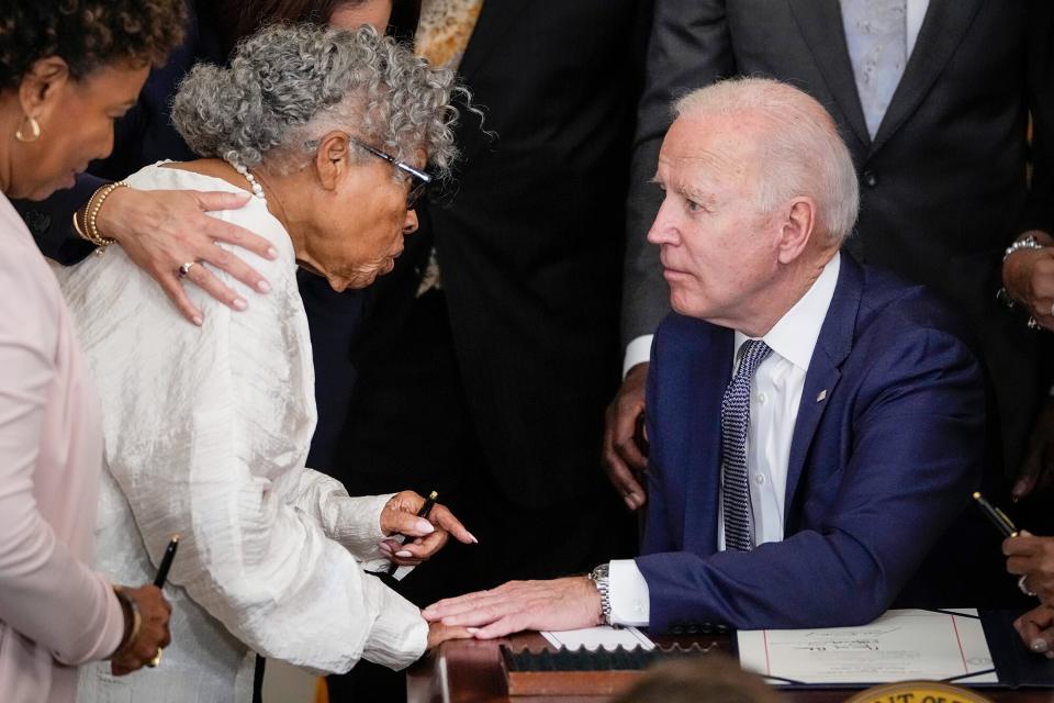 Ninety-four-year-old activist and retired educator Opal Lee, known as the Grandmother of Juneteenth, speaks with U.S. President Joe Biden after he signed the Juneteenth National Independence Day Act into law in the East Room of the White House on June 17, 2021 in Washington, DC