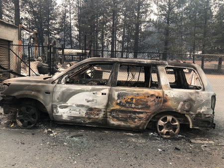 Ken’s Automotive Service repair shop lies in ruins after wildfires devastated the area in Paradise. Image: Reuters