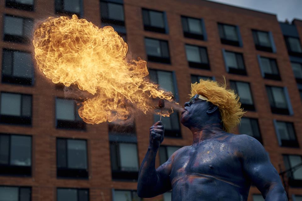A performer spits fire during the Mermaid Parade in the Coney Island section of the Brooklyn borough of New York, Saturday, June 22, 2024. (AP Photo/Andres Kudacki)